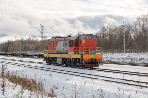 Train in winter. Old diesel locomotive on the railway.