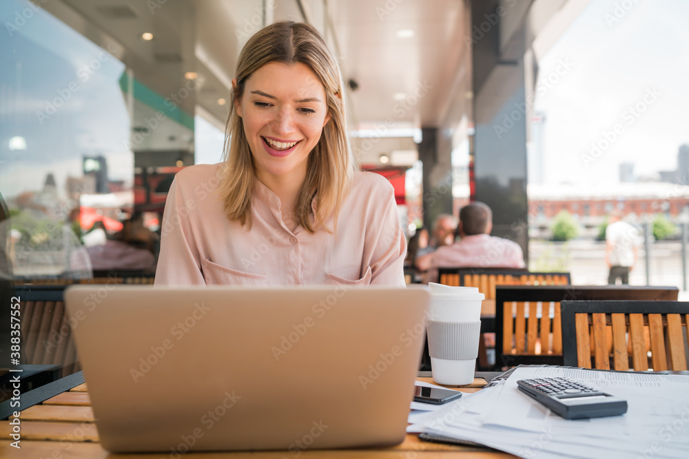 Fototapeta premium Young businesswoman working on her laptop.