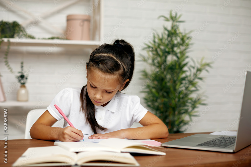 cute little child girl using computer for studying online e-learning system. online education concept cute little child girl using computer for studying online e-learning system. online education concept
