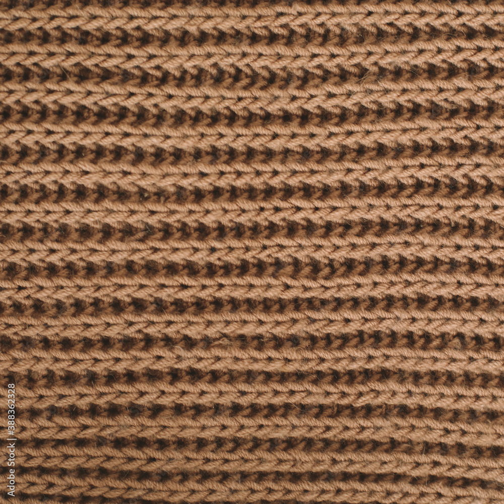 Knitted texture background. Knitting pattern of wool. Knitting. Texture of woolen fabric for wallpaper and abstract background. Knitted texture background. Knitting pattern of wool. Knitting. Texture of woolen fabric for wallpaper and abstract background.