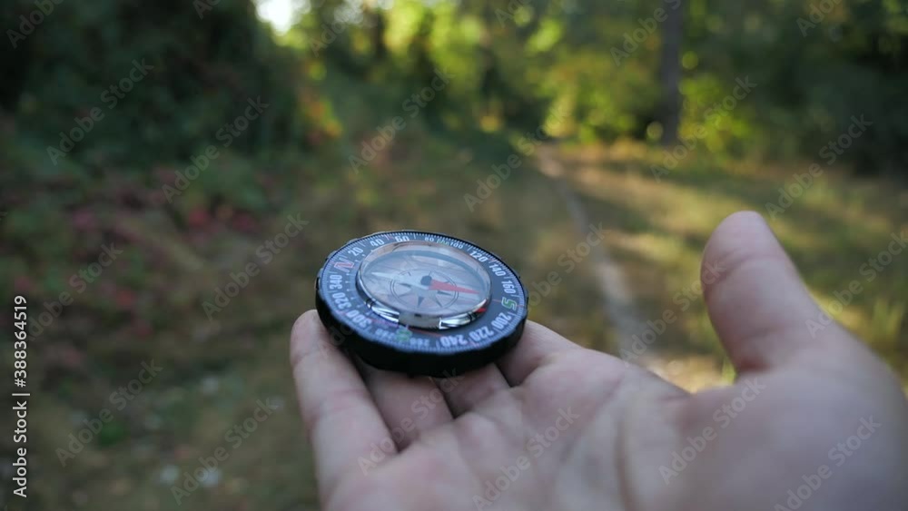 Female forwarder hands holding a compass and looking for direction. Orientation in forest 4k close-up in motion 4k Female forwarder hands holding a compass and looking for direction. Orientation in forest 4k close-up in motion 4k