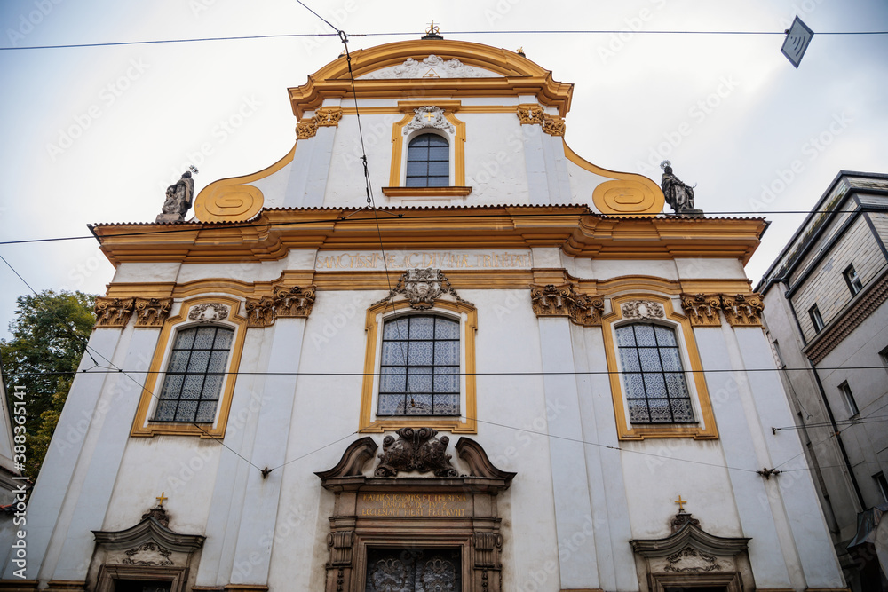 Obraz premium Beautiful Baroque Church of the Holy Trinity at Spalena street in the center of Prague during the autumn day, Czech Republic, Bohemia region