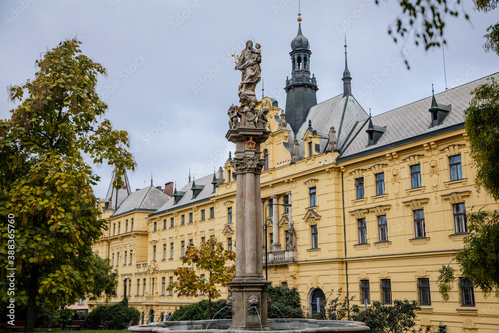 Fountain with a statue of St. Josefa at Charles Square near the renaissance building of Municipal Court and New Town Hall in the center of Prague, Czech Republic