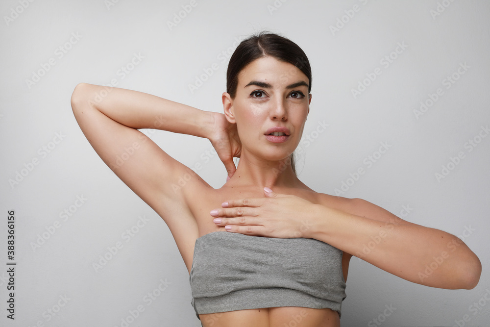 Portrait of pleasant-looking Caucasian woman wearing casual top looking happily in camera. Isolated on white background. Portrait of pleasant-looking Caucasian woman wearing casual top looking happily in camera. Isolated on white background.