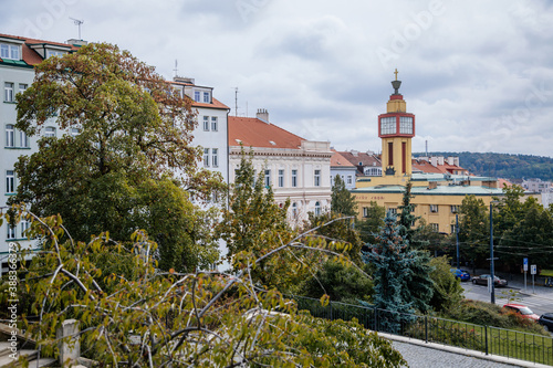 Vrsovice Square and tower of Hus' House (Husuv sbor), Hussite church during the autumn day, functionalism in architecture with elements of constructivism, Prague, Czech Republic photo