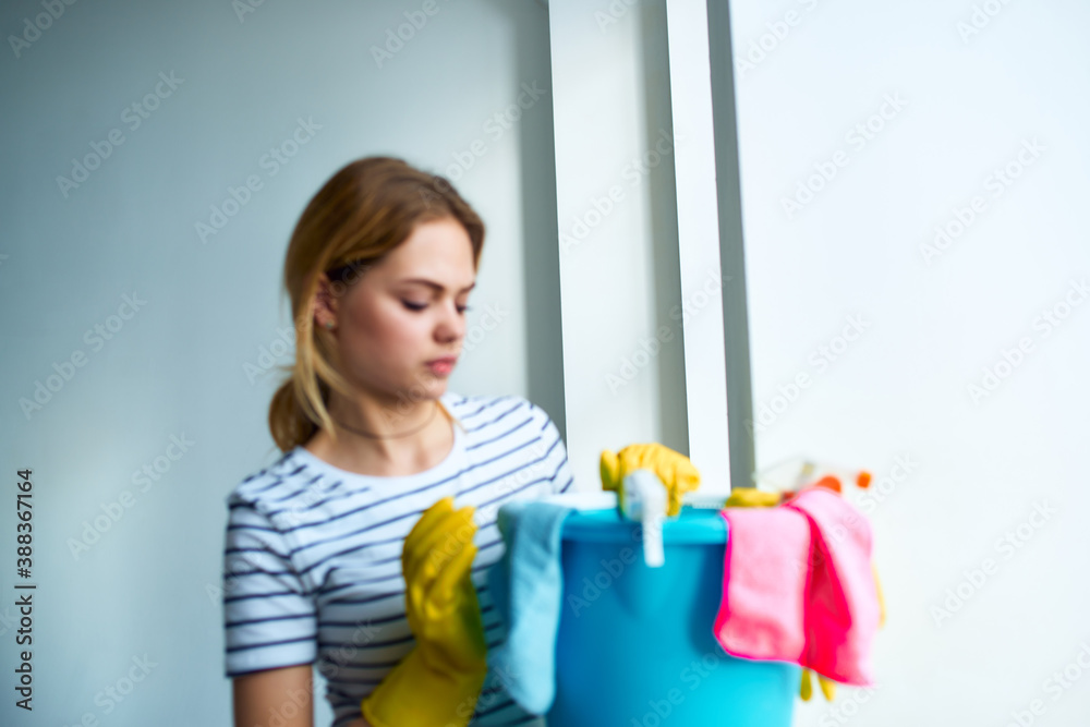 Cleaning lady in rubber gloves tools for washing home interior rendering services Cleaning lady in rubber gloves tools for washing home interior rendering services