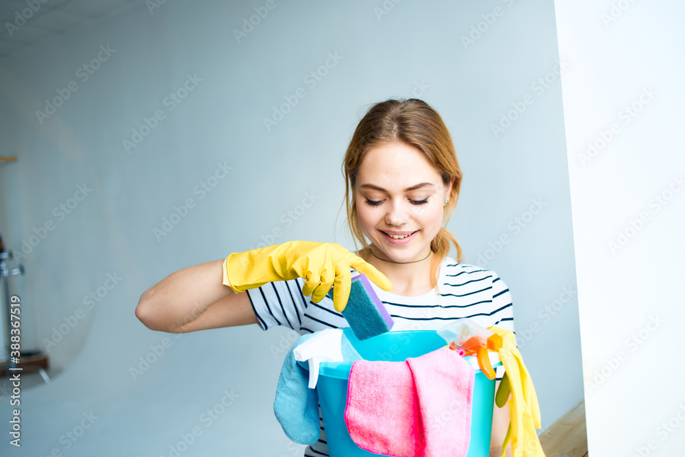 Cleaning lady in rubber gloves tools for washing home interior rendering services Cleaning lady in rubber gloves tools for washing home interior rendering services