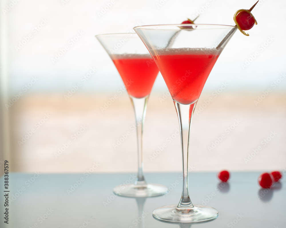 Pink cocktail with cherry