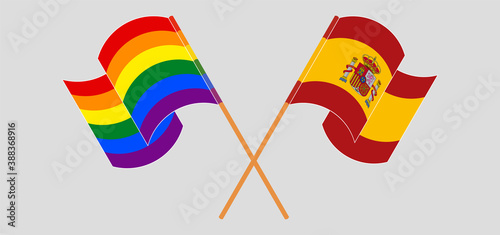 Crossed and waving flags of Spain and LGBTQ