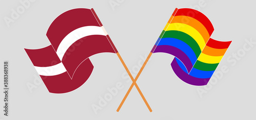 Crossed and waving flags of Latvia and LGBTQ