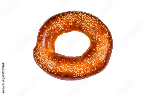 Bagel with sesame seeds isolated on white background