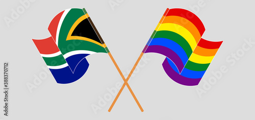 Crossed and waving flags of Republic of South Africa and LGBTQ