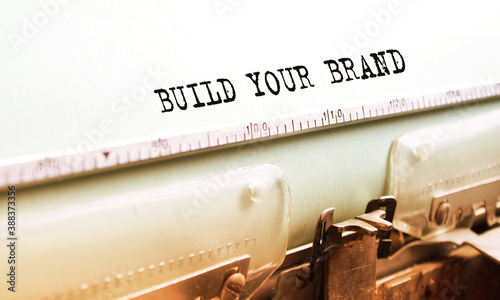 Angled text typed on paper using an antique typewriter. Vintage lettering, retro style, grunge, business or marketing concept.