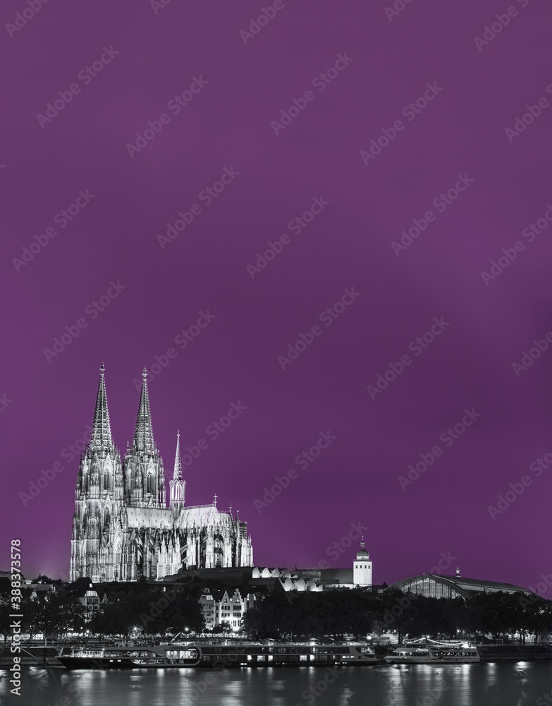 Cologne, Germany. Night View Of Cologne Cathedral. Catholic Gothic Cathedral In Night. UNESCO World Heritage Site. Toned Photo Black, White And Ultra Violet Colors