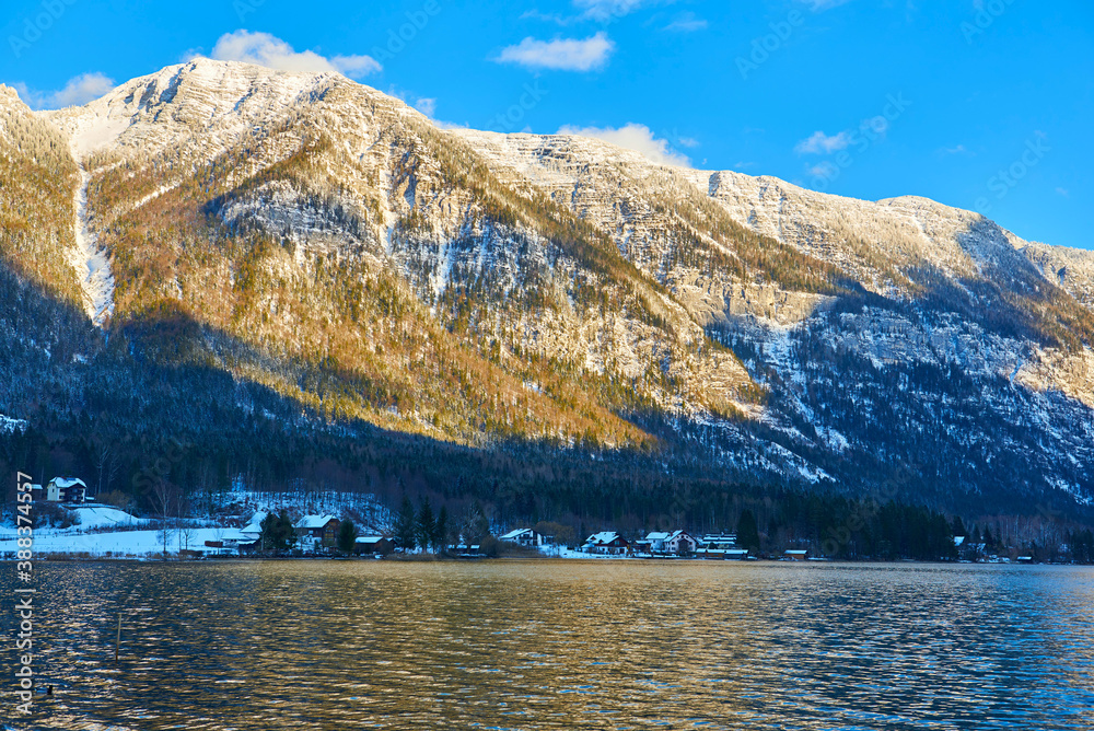 Hallstatt lake at sunny day, blue sky and mountain Sarstein. Winter, Salzkammergut region, Austria.