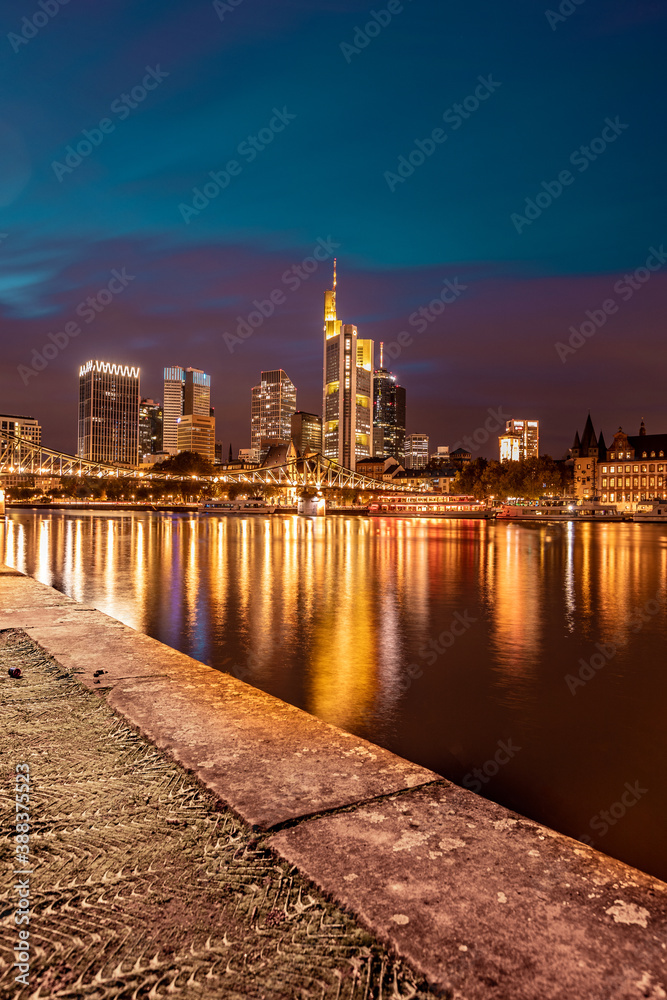 Fototapeta premium downtown city at night, skyline reflection in main river 