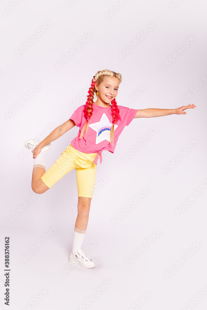 cute girl in bright colorful clothes and with colored braids cute girl in bright colorful clothes and with colored braids