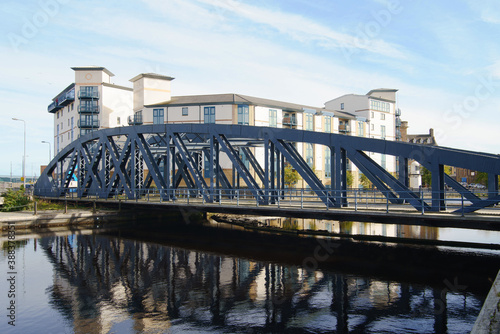 The Victoria swing bridge at Leith Docks, Edinburgh, Scotland, UK. Constructed fro 1871 to 1874, now disused. The new flats behind the bridge are part of the redevelopment of Leith.
