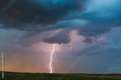 Lightning storm and clouds at sunset