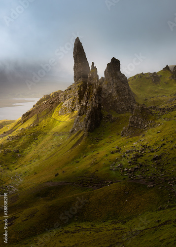 The breathtaking Old Man of Storr pinnacles on the Isle of Skye with dark moody clouds in background. 