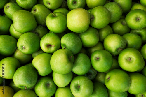 Green apples background. Beautiful green apples at the market