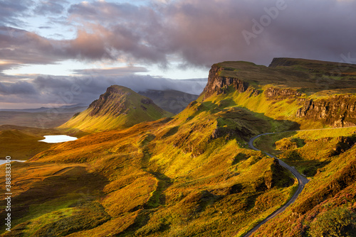 Morning light at The Quiraing on the beautiful Scottish Isle of Skye with winding road.