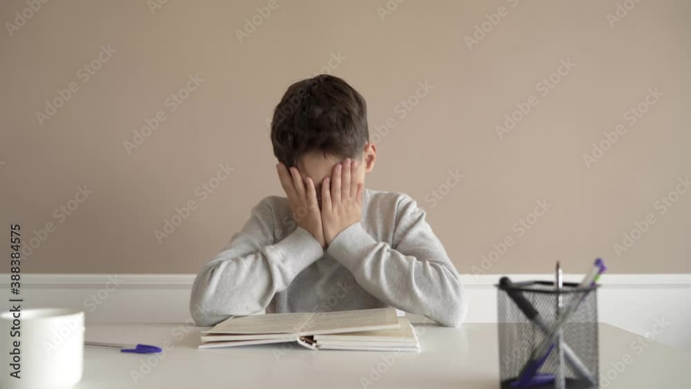 School boy having trouble with his homework