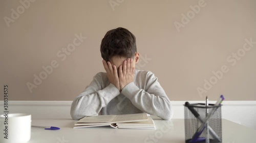School boy having trouble with his homework