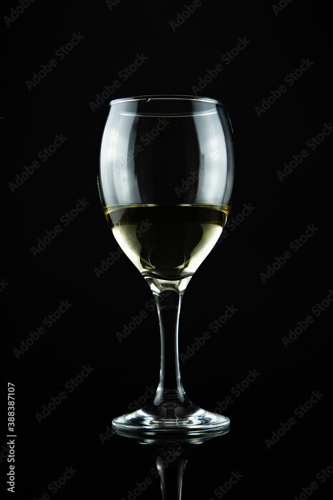 wine bottle and glass, black background
wine bottle and glass, black background