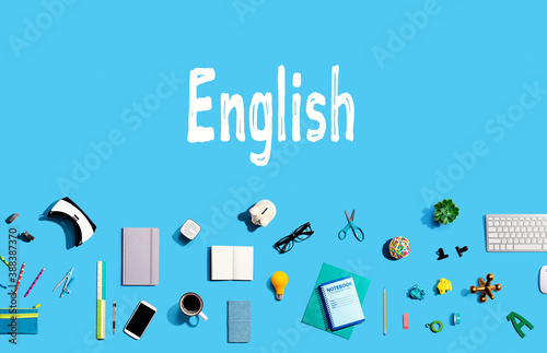 Learning English concept with collection of electronic gadgets and office supplies