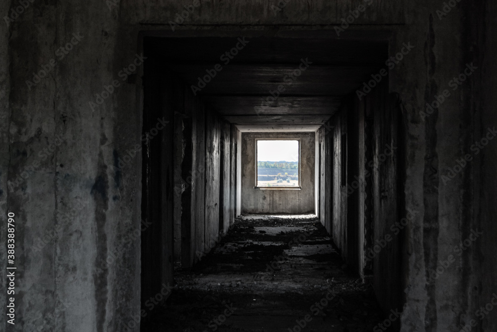 Dark cold weathered abandoned floor way with lighted picture like window in the end. From darkness to new beginning Dark cold weathered abandoned floor way with lighted picture like window in the end. From darkness to new beginning