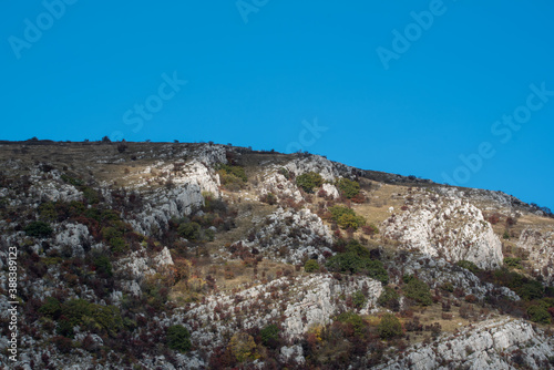 Bulgarian countryside rock hill autumn shades sunny day green warm forest