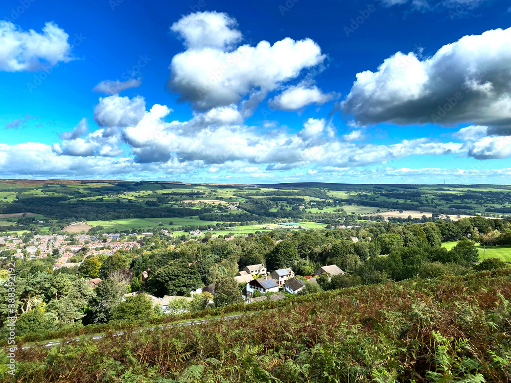 Landscape view over Ilkley, with houses, fields, valleys and hills, in the far distance near, Ilkley Yorkshire, UK