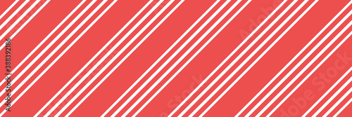 Vector Christmas background with diagonal stripes pattern, candy cane. Long horizontal banner.