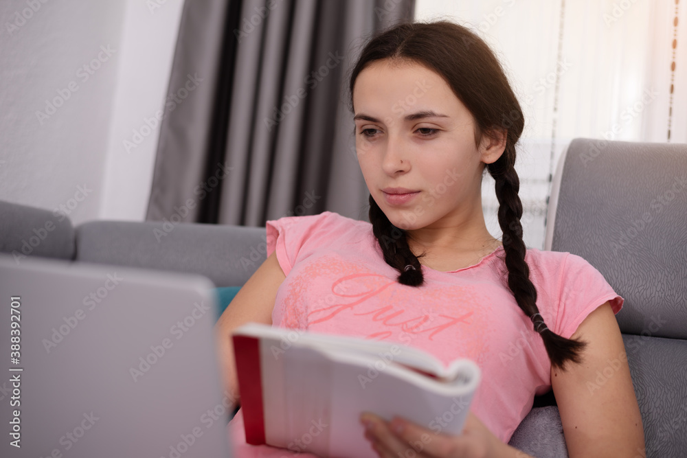 Teenage girl having online school class at home. Home Schooling. Learning from home in coronavirus times. Teenage girl having online school class at home. Home Schooling. Learning from home in coronavirus times.