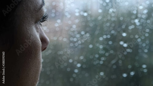 Wallpaper Mural sadness, depression - pensive woman looks out the window in a rainy day - macro Torontodigital.ca