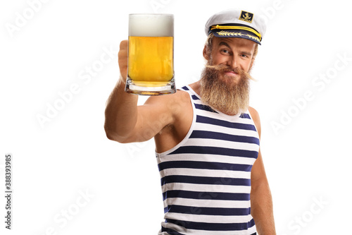 Obraz na plátne Bearded guy sailor toasting with a mug of beer