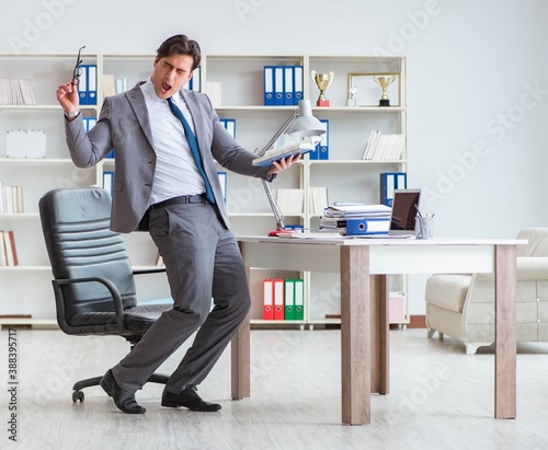 Businessman having fun taking a break in the office at work