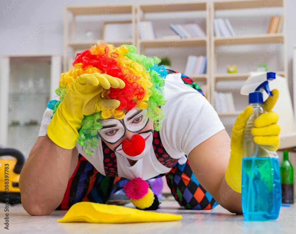 Funny clown doing cleaning at home Funny clown doing cleaning at home