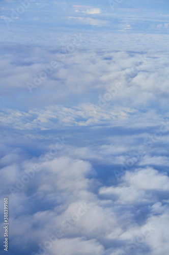 Fototapeta Naklejka Na Ścianę i Meble -  clouds texture seen froma plane window high in the sky
