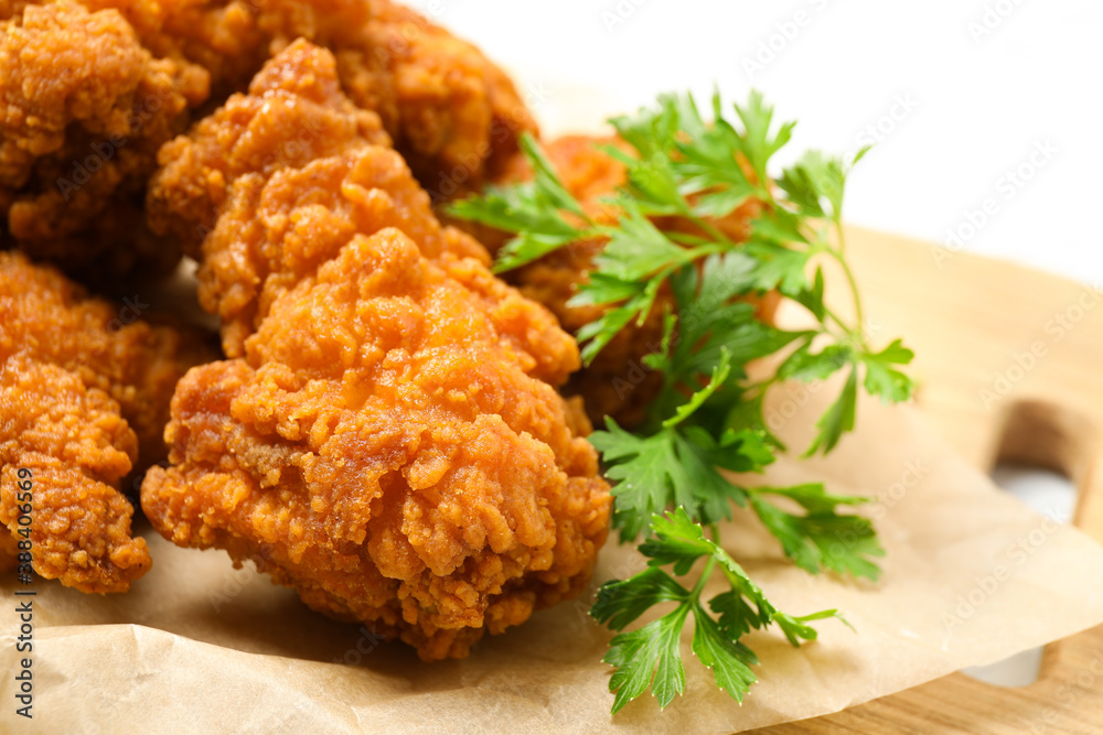 Tasty deep fried chicken pieces served on table, closeup Tasty deep fried chicken pieces served on table, closeup