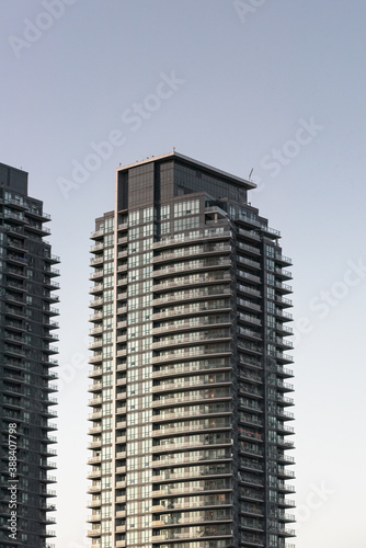 Photography Details of high a rise tower against a clear sky at dusk.