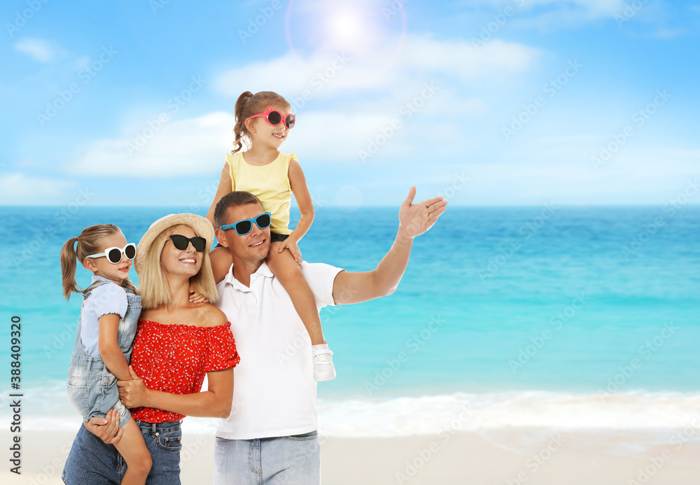 Happy family near sea on sunny day. Summer vacation Happy family near sea on sunny day. Summer vacation