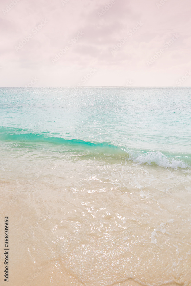 waves on a white sand beach in aruba