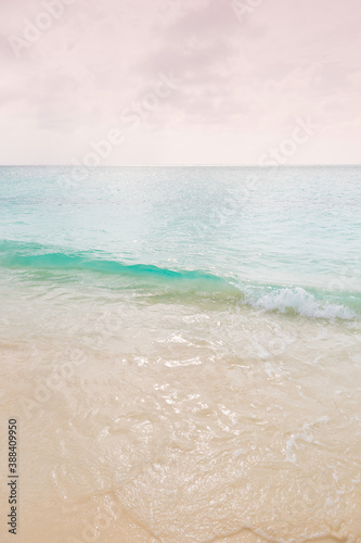 waves on a white sand beach in aruba
