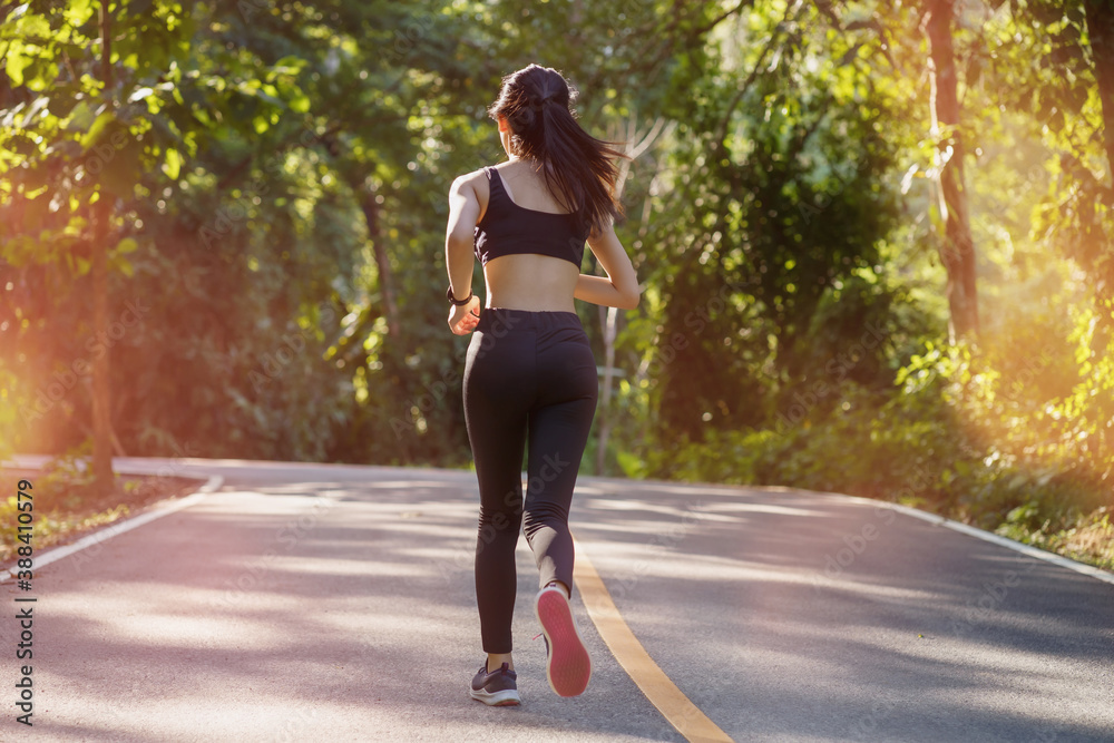 Beautiful young woman jogging during outdoor workout, exercising outdoors, running woman. Beautiful young woman jogging during outdoor workout, exercising outdoors, running woman.