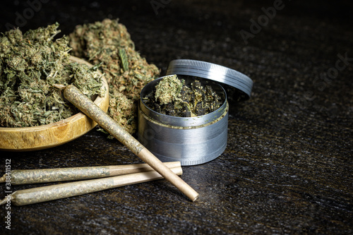 Marijuana Grinder with bowl and joints photo