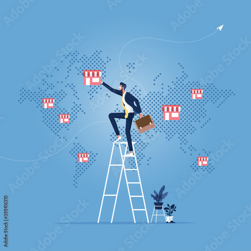 Franchise or trading network concept-Scaling of business, Businessman hand put franchise store on world map, Franchise business concept