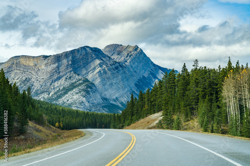 Rural road in the forest with Mount Stelfox in the background. Alberta Highway 11 (David Thompson Hwy), Jasper National Park, Canada. © Shawn.ccf