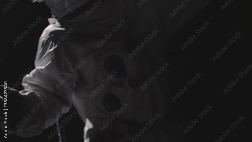 A person turns around in a space suit A person turns around in a space suit